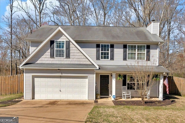 81 Summer Creek Dr, Dallas, GA 30157 - traditional-style house featuring concrete driveway, fence, covered porch, and a chimney