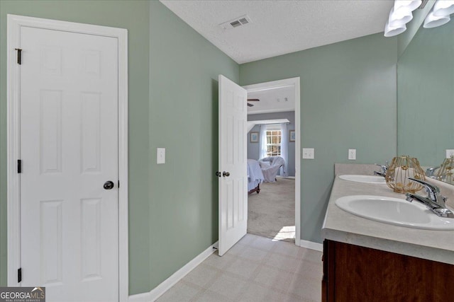 81 Summer Creek Dr, Dallas, GA 30157 - ensuite bathroom with a sink, visible vents, a textured ceiling, and tile patterned floors