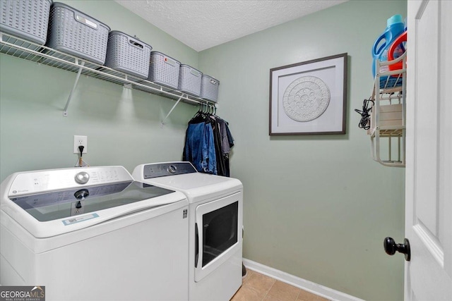 81 Summer Creek Dr, Dallas, GA 30157 - washroom featuring light tile patterned floors, baseboards, laundry area, a textured ceiling, and washer and clothes dryer