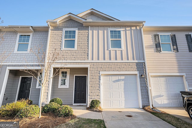 308 Penn Station Way, Cartersville, GA 30120 - townhome / multi-family property featuring board and batten siding, concrete driveway, and an attached garage