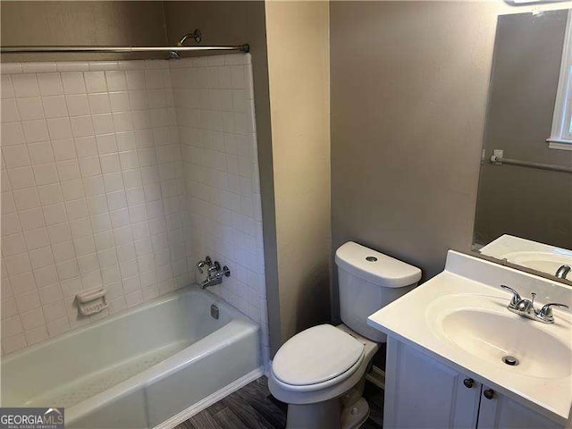 full bathroom featuring vanity,  shower combination, toilet, and wood finished floors