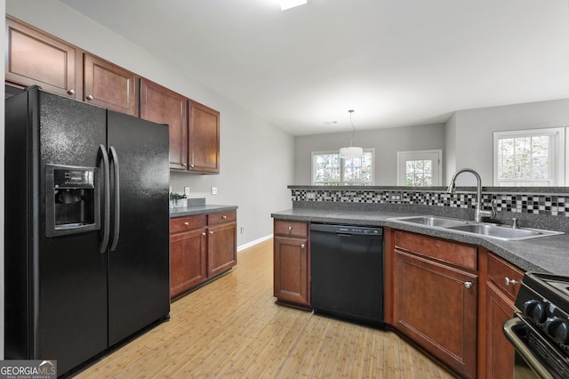 3258 Welmingham Dr SW, Atlanta, GA 30331 - kitchen with a sink, light wood-style floors, tasteful backsplash, black appliances, and dark countertops
