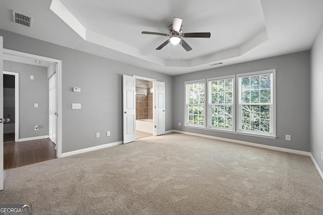 3258 Welmingham Dr SW, Atlanta, GA 30331 - unfurnished bedroom featuring visible vents, baseboards, carpet floors, and a tray ceiling