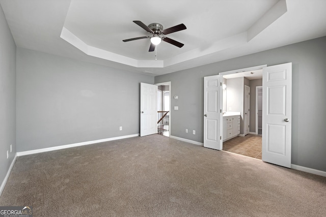 3258 Welmingham Dr SW, Atlanta, GA 30331 - unfurnished bedroom with carpet flooring, ensuite bath, a raised ceiling, and baseboards