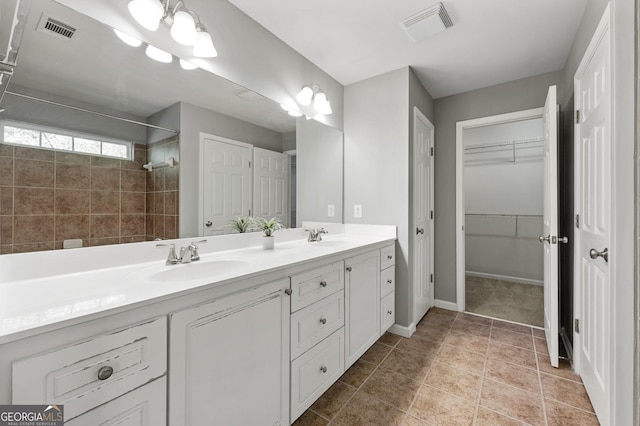 3258 Welmingham Dr SW, Atlanta, GA 30331 - full bathroom with visible vents, double vanity, and a sink