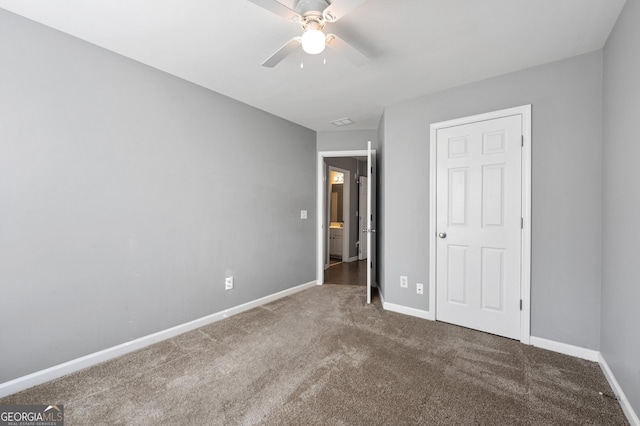 3258 Welmingham Dr SW, Atlanta, GA 30331 - unfurnished bedroom featuring a ceiling fan, carpet floors, and baseboards