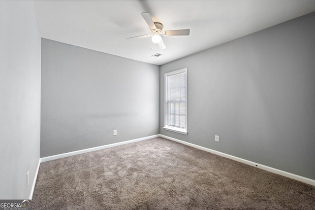 3258 Welmingham Dr SW, Atlanta, GA 30331 - empty room featuring a ceiling fan, carpet flooring, and baseboards