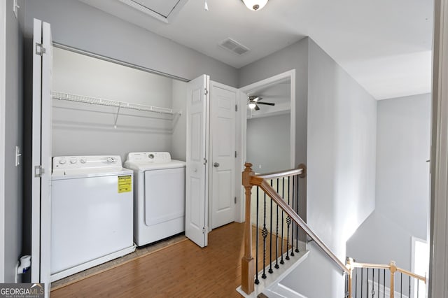 3258 Welmingham Dr SW, Atlanta, GA 30331 - laundry area with ceiling fan, visible vents, washer and clothes dryer, wood finished floors, and laundry area