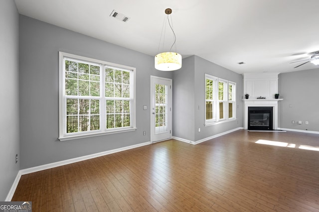 3258 Welmingham Dr SW, Atlanta, GA 30331 - unfurnished living room with a fireplace, visible vents, ceiling fan, and baseboards