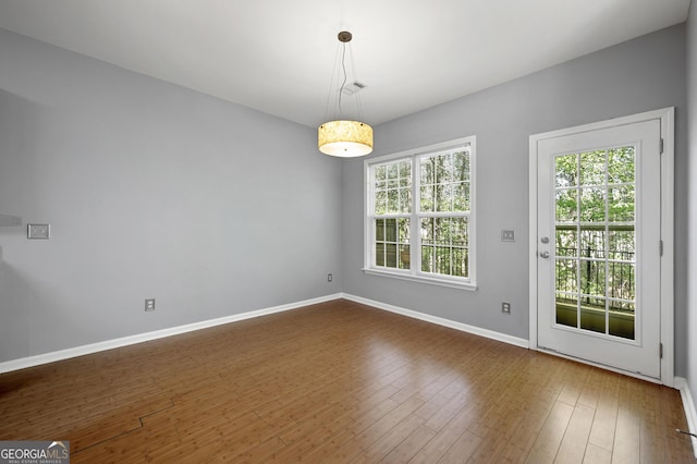 3258 Welmingham Dr SW, Atlanta, GA 30331 - unfurnished dining area featuring dark wood finished floors and baseboards