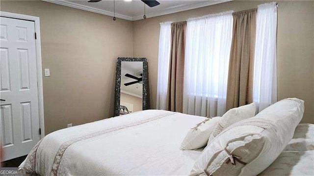 bedroom with crown molding and a ceiling fan