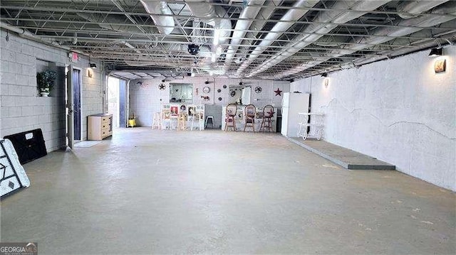 basement with freestanding refrigerator