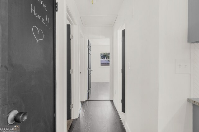 hallway with wood finished floors
