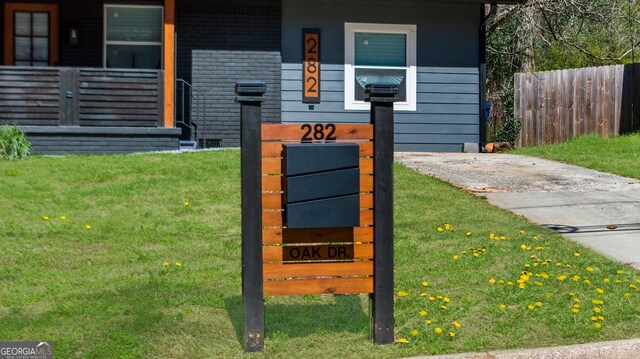 exterior details with fence and brick siding