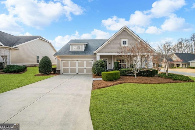 craftsman house featuring a garage, driveway, and a front yard