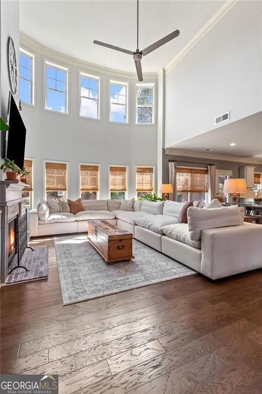 9085 Maple Run Trl, Gainesville, GA 30506 - living room featuring a high ceiling, a warm lit fireplace, and a barn door