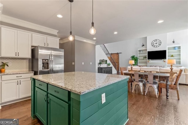 9085 Maple Run Trl, Gainesville, GA 30506 - kitchen featuring stainless steel refrigerator with ice dispenser, white cabinetry, ornamental molding, a barn door, and wood finished floors
