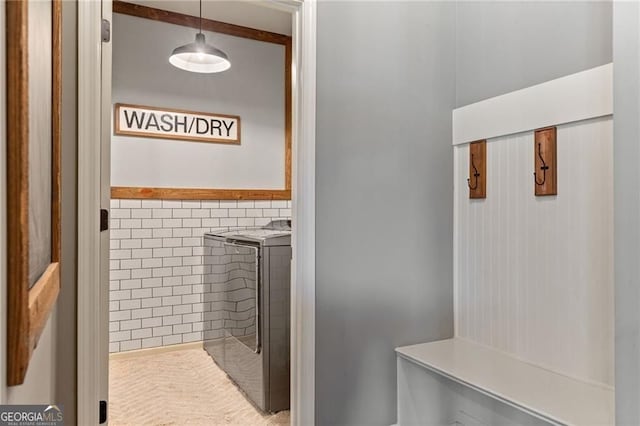 bathroom with washer and clothes dryer
