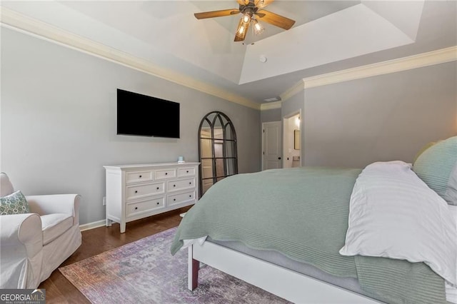 bedroom with wood finished floors, a ceiling fan, baseboards, and ornamental molding