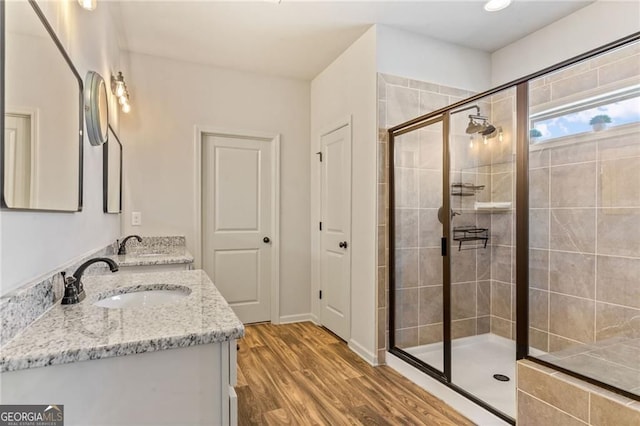 9085 Maple Run Trl, Gainesville, GA 30506 - bathroom featuring vanity, a stall shower, and wood finished floors