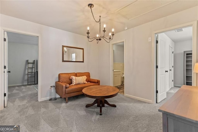 living area featuring attic access, visible vents, baseboards, and light carpet