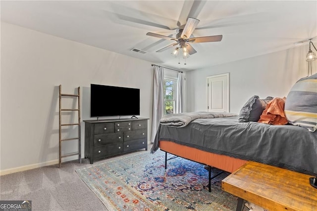 bedroom featuring baseboards, visible vents, carpet floors, and ceiling fan