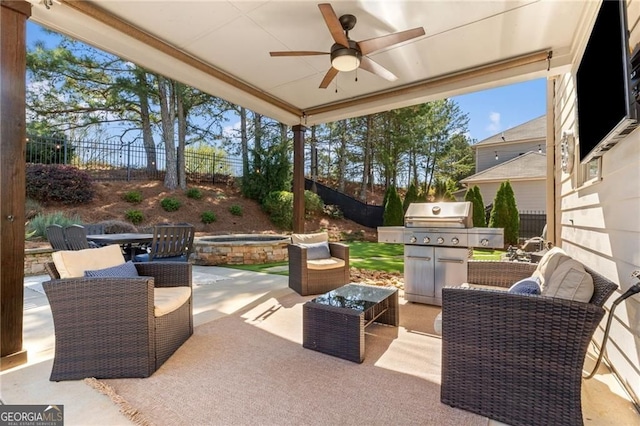 view of patio / terrace featuring a fenced backyard, a ceiling fan, a grill, and an in ground hot tub
