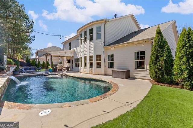 rear view of house with a pergola, an outdoor living space, a lawn, a patio, and a fenced in pool