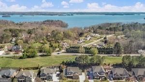 drone / aerial view with a residential view and a water view