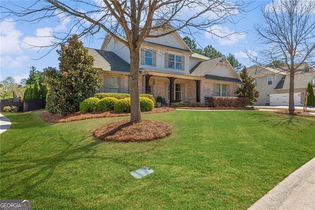 view of front of property with a front lawn and fence