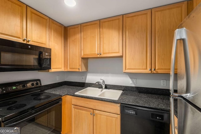 195 14th St NE Unit 1404, Atlanta, GA 30309 - kitchen with dark countertops, black appliances, and a sink