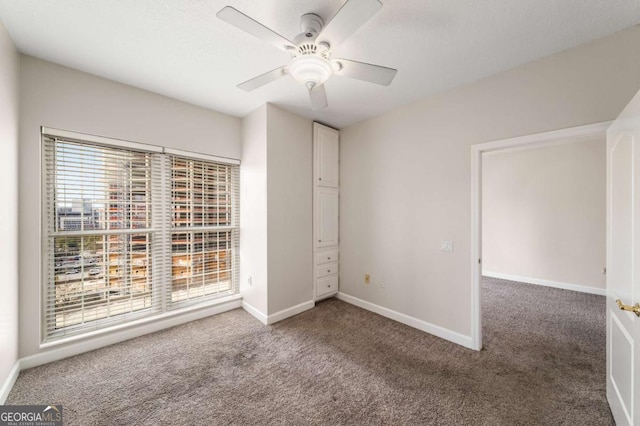 195 14th St NE Unit 1404, Atlanta, GA 30309 - carpeted empty room with baseboards and ceiling fan