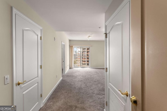 195 14th St NE Unit 1404, Atlanta, GA 30309 - hallway with carpet flooring and baseboards