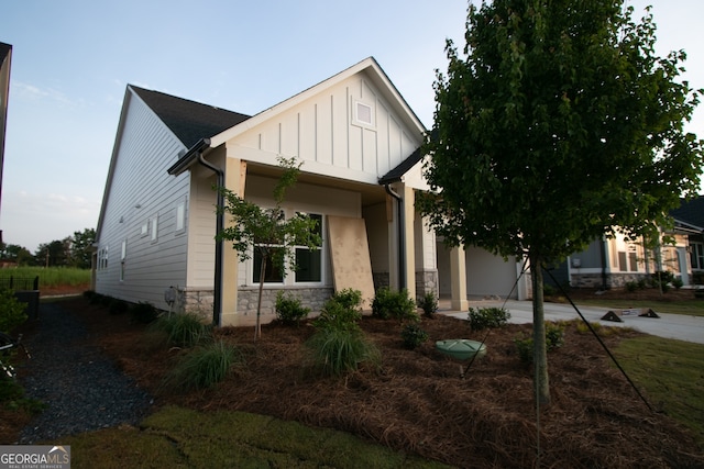2044 Ripple Park Bnd, Canton, GA 30114 - view of front of house featuring stone siding and board and batten siding