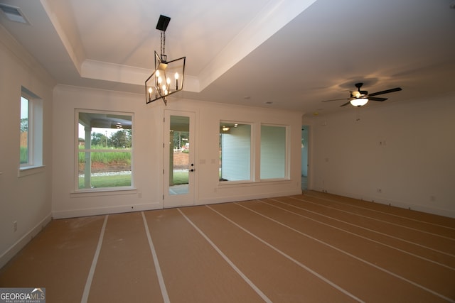2044 Ripple Park Bnd, Canton, GA 30114 - empty room featuring ornamental molding, a chandelier, ceiling fan, and a tray ceiling