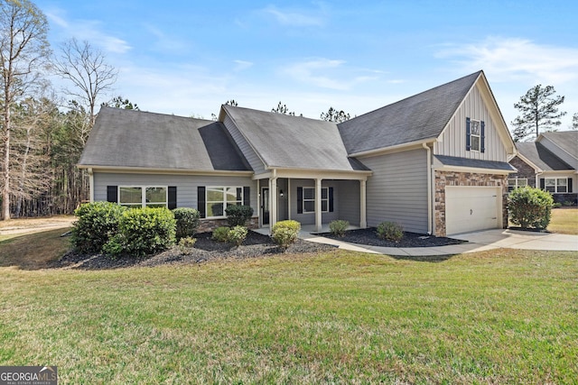 view of front of property with concrete driveway, stone siding, and a front lawn