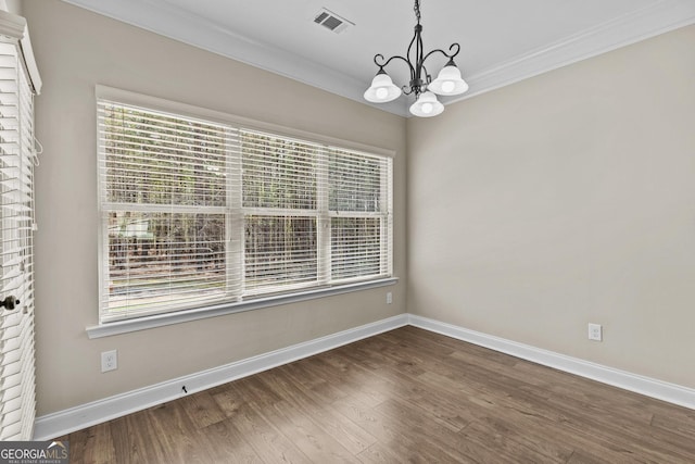 unfurnished dining area with visible vents, ornamental molding, a chandelier, and a healthy amount of sunlight