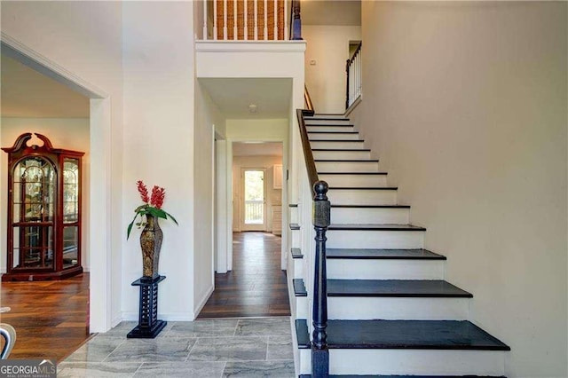 77 Hunters Grn, Dallas, GA 30157 - staircase with baseboards and wood finished floors