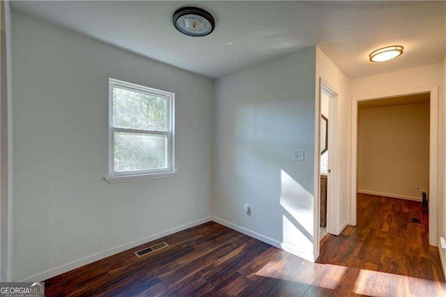 77 Hunters Grn, Dallas, GA 30157 - unfurnished bedroom featuring visible vents, baseboards, and wood finished floors