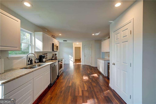 77 Hunters Grn, Dallas, GA 30157 - kitchen with white cabinetry, dark wood finished floors, appliances with stainless steel finishes, and a sink