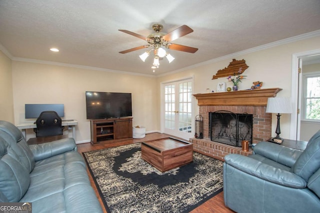 207 Lakeshore Way, Lagrange, GA 30240 - living area featuring wood finished floors, a ceiling fan, crown molding, a brick fireplace, and recessed lighting
