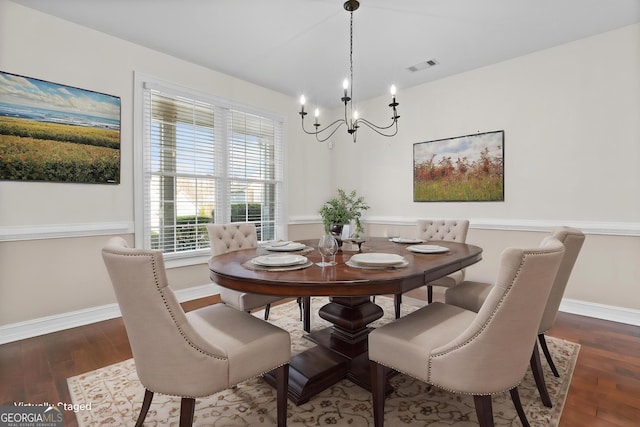 675 Timber Ives Dr, Dacula, GA 30019 - dining space featuring a chandelier, wood finished floors, and baseboards