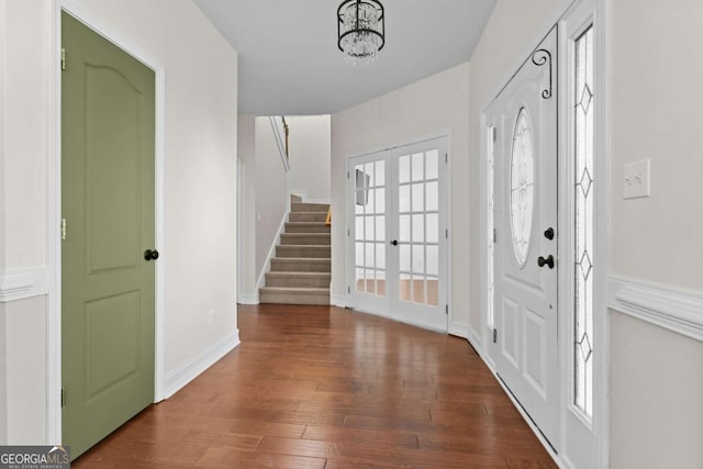 675 Timber Ives Dr, Dacula, GA 30019 - foyer featuring french doors, stairs, wood finished floors, baseboards, and a chandelier
