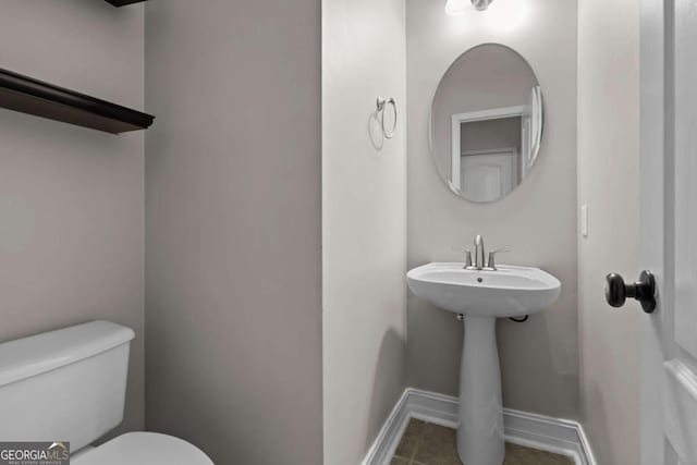675 Timber Ives Dr, Dacula, GA 30019 - bathroom featuring toilet, tile patterned flooring, and baseboards