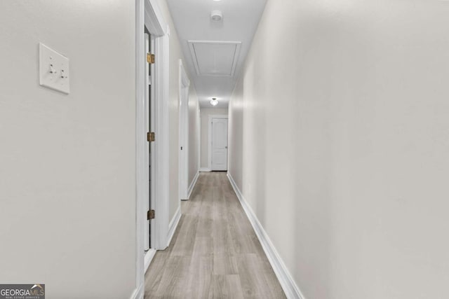 675 Timber Ives Dr, Dacula, GA 30019 - hallway featuring attic access, light wood-style floors, and baseboards