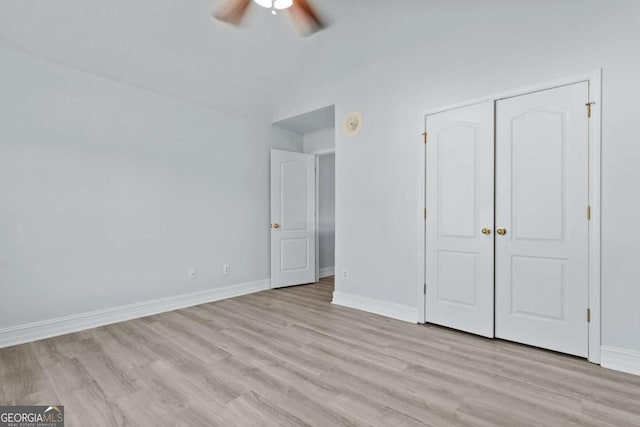 675 Timber Ives Dr, Dacula, GA 30019 - unfurnished bedroom featuring light wood-style floors, baseboards, vaulted ceiling, and ceiling fan