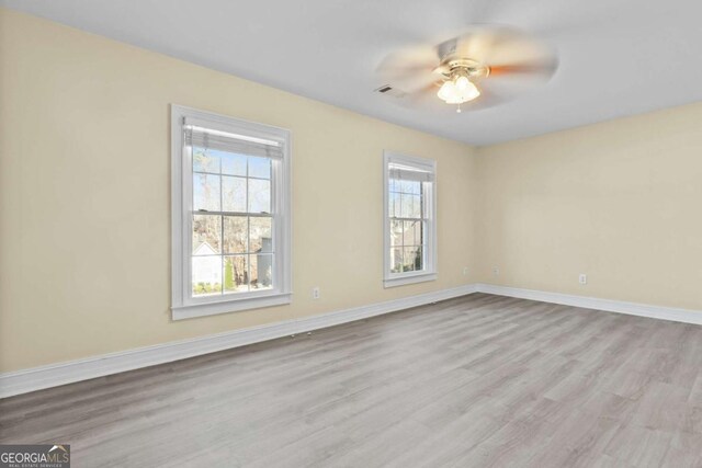 675 Timber Ives Dr, Dacula, GA 30019 - unfurnished room with a ceiling fan, wood finished floors, and baseboards