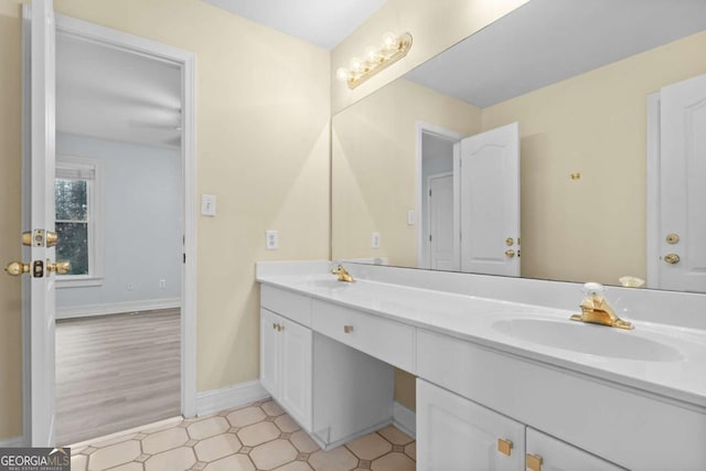 675 Timber Ives Dr, Dacula, GA 30019 - bathroom with double vanity and baseboards
