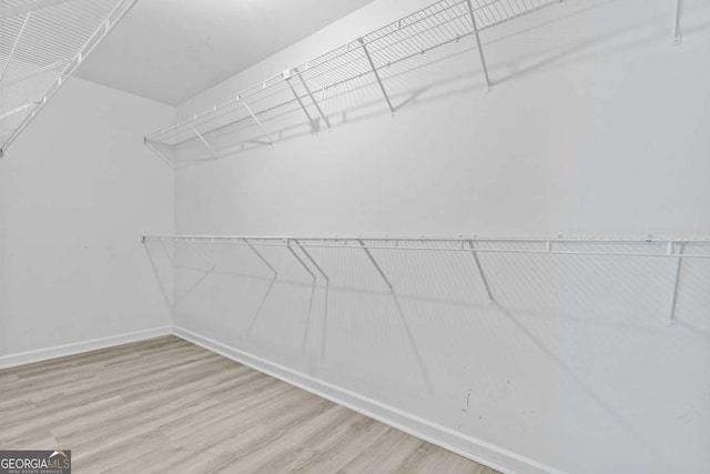 675 Timber Ives Dr, Dacula, GA 30019 - spacious closet with wood finished floors