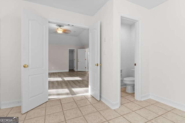 675 Timber Ives Dr, Dacula, GA 30019 - bathroom featuring toilet, tile patterned floors, baseboards, lofted ceiling, and ceiling fan